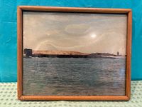 Framed color photograph showing American submarine on water