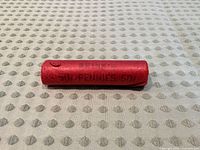 Front view of red Brink's penny roll showing main text