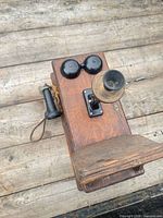 Top view showing oak case, twin bells, brass transmitter, side handset and shelf