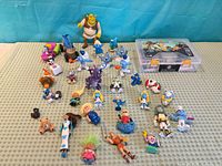 Top-down view of entire lot showing Robotryx kit and assorted figurines