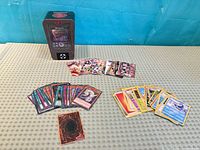 Overview of tin, Yu-Gi-Oh!, Pokémon and NFL cards spread