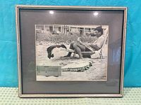 Front view of framed photograph showing image, matting and frame