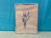 Front view of framed blue cattails artwork