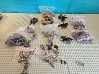 Overhead view of entire lot showing bagged groups of soldiers, vehicles and accessories