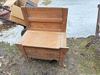 Front view of wooden entryway bench closed