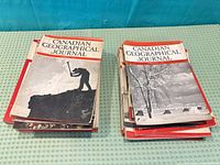 Two stacks of Canadian Geographical Journal issues
