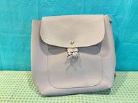 Front view of light purple Lily Morgan backpack purse with flap and drawstring