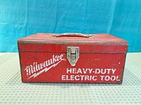 Front view showing logo, latch, handle