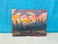 Front of sunset landscape painting on board