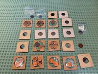 Overall view of all coins arranged on table