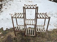 Front view showing six-shelf tiered teak plant stand