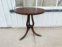 Full view of round wooden pedestal table