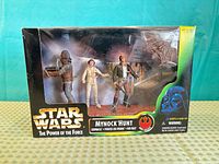 Front view of sealed box showing figures and graphics