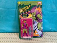 Front view of sealed Green Goblin figure on card