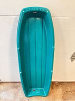 Full view of teal Torpedo sled front side