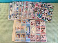 Binder pages showing fronts and backs of NHL Pro Set hockey cards