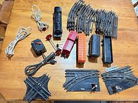 Full lot overview showing locomotive, cars, transformer, signal, track pieces