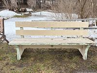 Front view of full wooden bench outdoors
