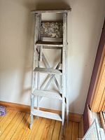 Front view of wooden step ladder folded