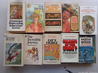 Ten paperbacks including Twain, Dickens, automobile and biography titles