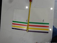Flat Hudson’s Bay gift box with measuring tape showing size