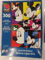 Front of Mickey Unlimited 300-piece poster puzzle box showing artwork and piece count