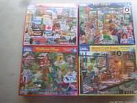 Front view of four shrink-wrapped 1000-piece White Mountain jigsaw puzzles: I Love Canada!, Pet Shop, Birdhouse Village, Mom's Craft Room