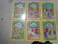 Six Cabbage Patch Kids storybooks arranged in two rows