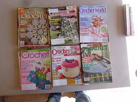 Six magazines: Old-Time Crochet, Crochet World, Crochet!, etc., laid out on table