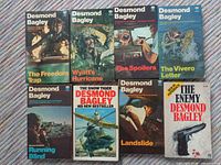 Front covers of all eight Desmond Bagley paperback novels arranged in two rows