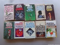 Ten paperback novels laid out in two rows including A Murder Is Announced and Appointment with Death