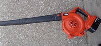 Cordless Black & Decker leaf blower with battery attached