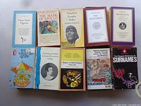First image showing 10 paperback books in two rows
