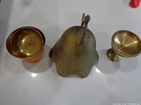 Brass bell, copper cup and brass pedestal cup