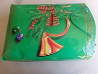 Green gift bag with French horn design showing material, handle type, wear