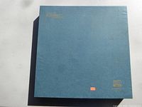 Blue square storage box with Scrabble branding