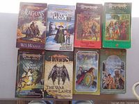 Eight paperbacks laid out on tabletop