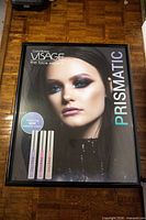 Front view of one frame with Visage Prismatic poster