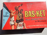Game box lid showing Bas-Ket branding and artwork