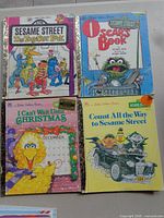 Four Sesame Street Little Golden Books displayed front covers visible