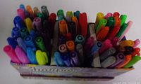 Top view of assorted Sharpie markers in box
