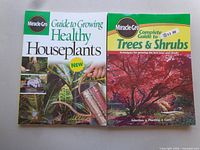 Front covers of Guide to Growing Healthy Houseplants and Complete Guide to Trees & Shrubs