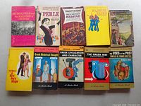 Ten paperbacks arranged in two rows