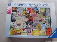 Front of sealed Ravensburger 1000-piece puzzle box showing wine label collage artwork