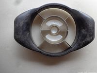 Top view of pineapple wedger showing four blades and central corer