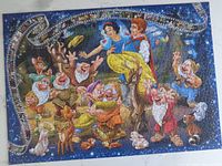 Completed 1000-piece Ravensburger Disney Snow White puzzle laid out