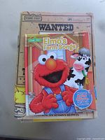 Stack showing Wanted: The Great Cookie Thief and Elmo’s Farm Songs