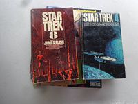 Stack of Star Trek paperbacks showing Star Trek 8 and Star Trek 4 on top