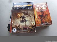 Stack of Star Wars Epic Battles DK Reader and Planet of Twilight visible, additional books beneath