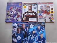 Top view of five hockey publications arranged in two rows